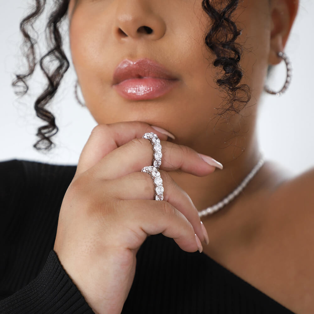 Dark skinned woman wearing double silver ring eternity band
